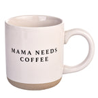 Mama Needs Coffee cream stoneware mug with speckled glaze and raw clay base on white background