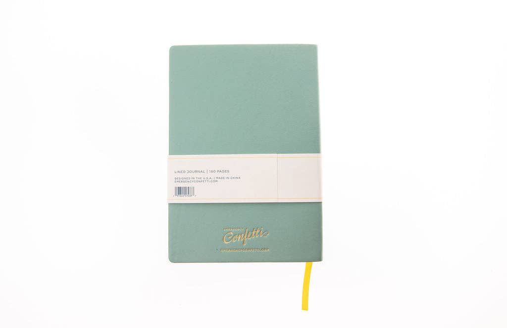 Back cover of the sage green Another Trip Around The Sun journal with a yellow ribbon bookmark and Emergency Confetti gold foil logo