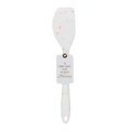 A white silicone spatula with a colorful sprinkle pattern and a hanging tag that reads 'To Complement Your Kitchen Dancing', shown on a plain white background.