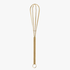 Gold mini wire whisk on white background