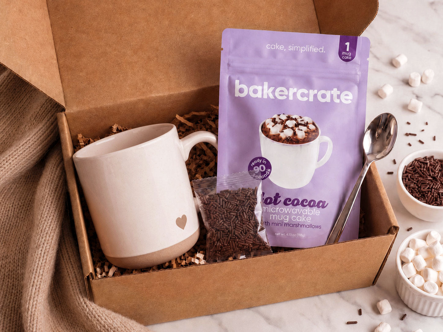 Bakercrate mug cake package with a mug and spoon in a box