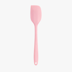 Pink mini silicone spatula on white background
